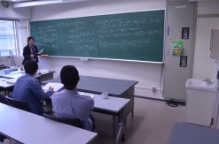 A graduate student at Department of Mathematics discussing at a seminar
